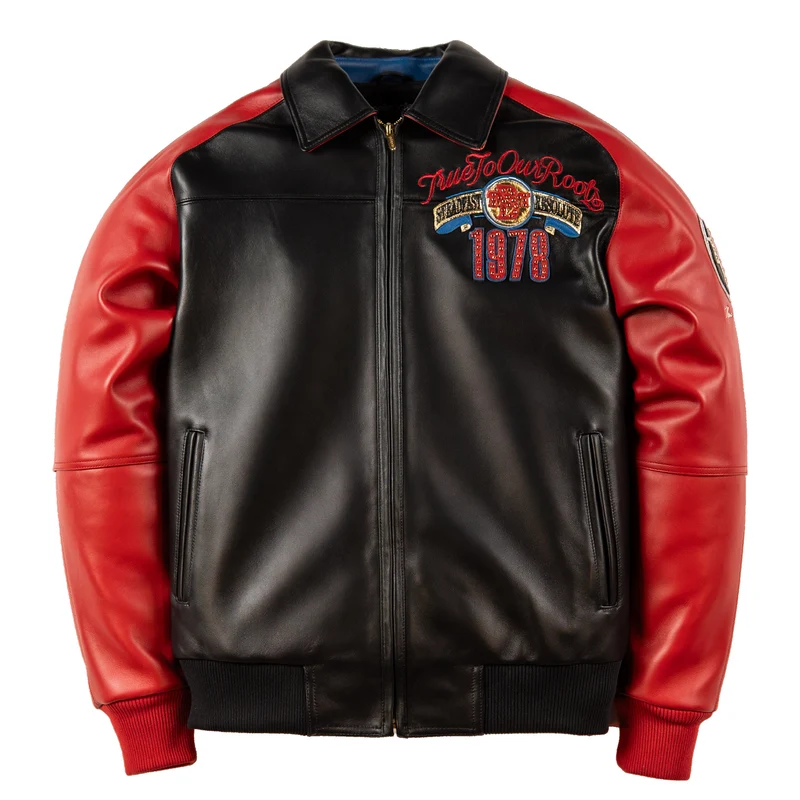 Front of red and black True To Our Roots leather jacket with pointed collar, chest graphics and ribbed trim.