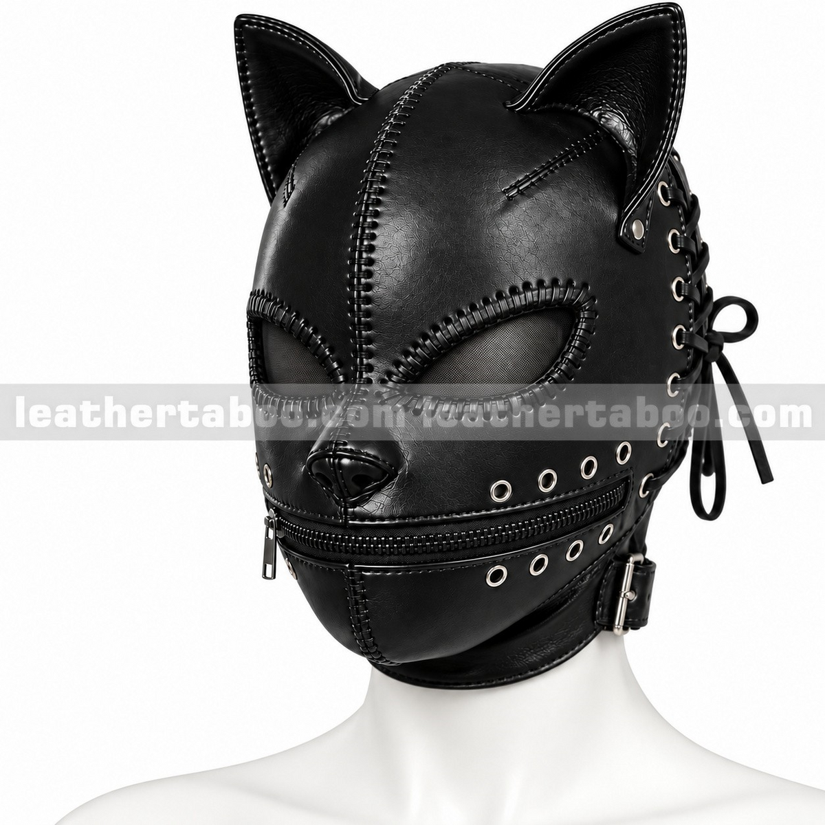 Angled front view of black leather cat mask with pointed ears, mesh eye panels, mouth zipper, metal eyelets and decorative seam detailing.