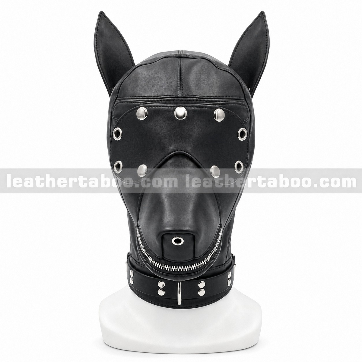 Front view of black leather dog hood showing tall ears, snap-detailed eye cover, muzzle zipper, nose eyelet and collar ring on a white mannequin.