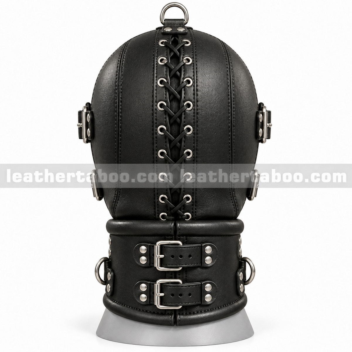 Rear view of black leather hood with central lacing, metal eyelets, crown D-ring and wide collar with two buckle straps on a white display form.