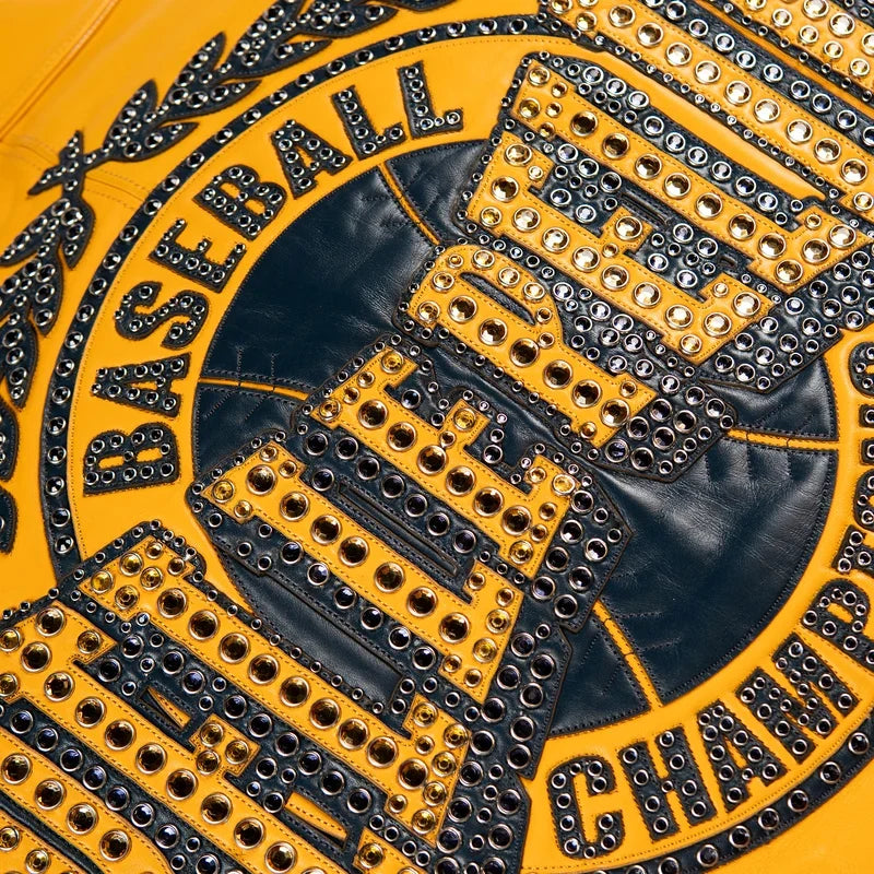Close-up of Pelle Pelle Champions Jacket back artwork showing navy and maize leather appliqué, metal studs and detailed stitching.