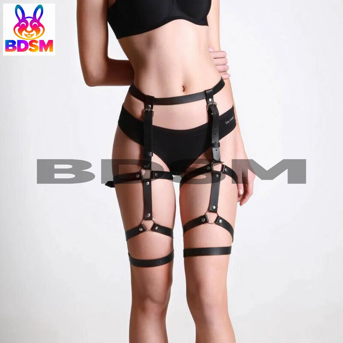 Front view of a black genuine leather garter harness showing the waist belt, vertical straps, and adjustable thigh bands.