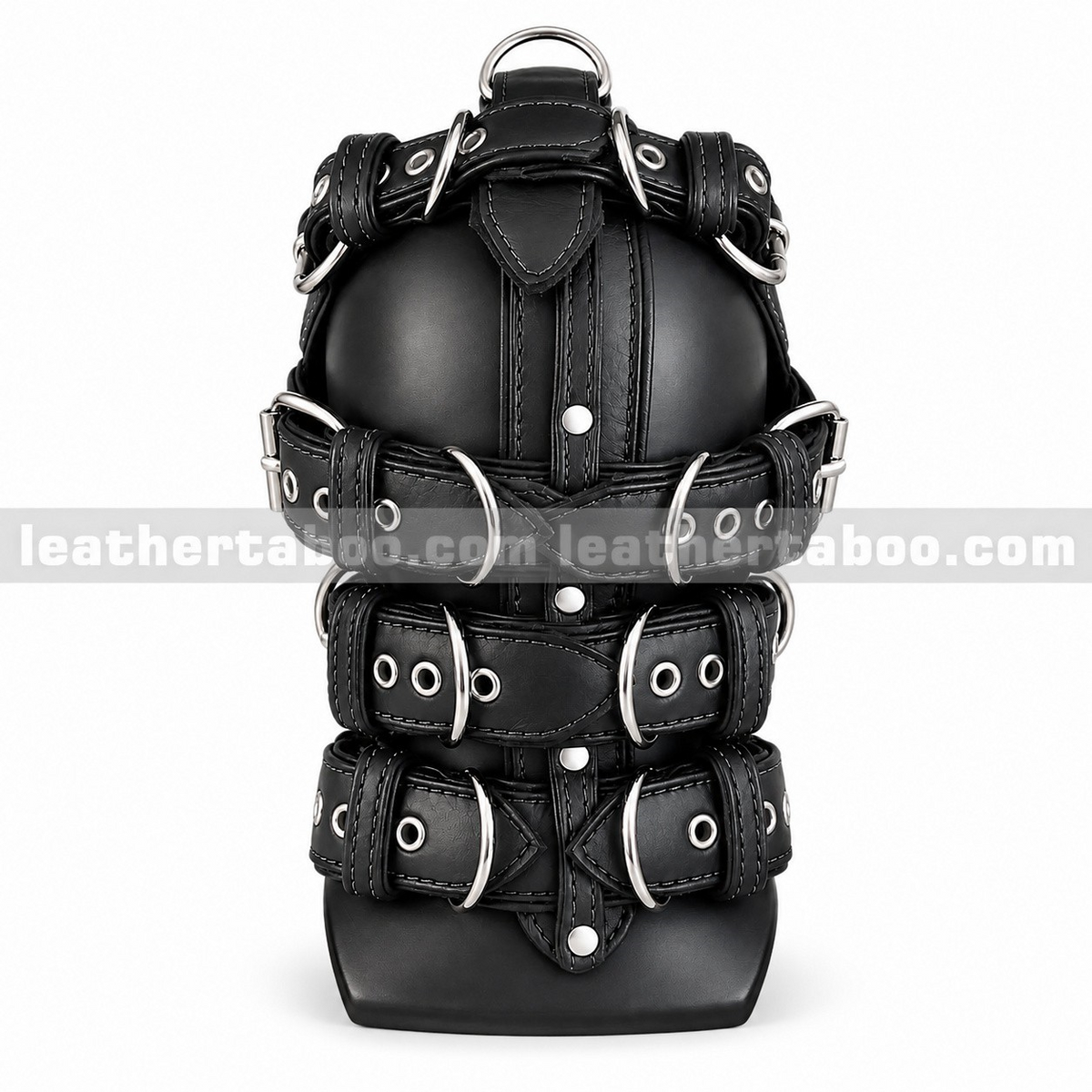 Back view of black leather harness hood mask with multiple buckled straps, metal eyelets and a central snap-fastened strip on a white background.